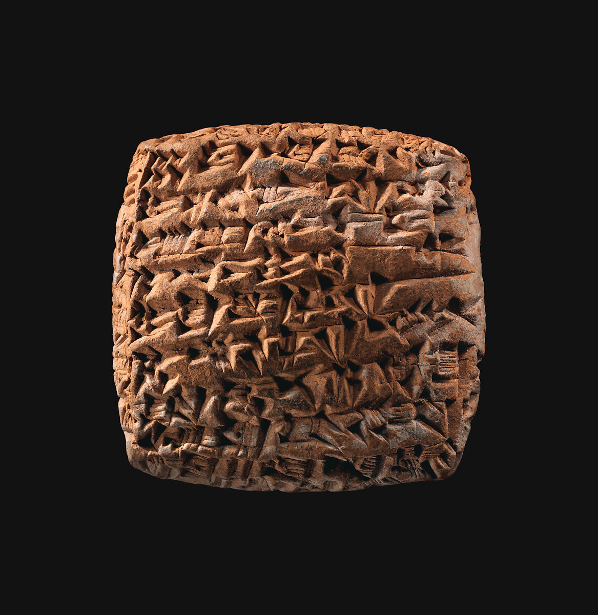 Clay tablet covered in closely spaced cuneiform impressions; a surviving record of a silver loan.