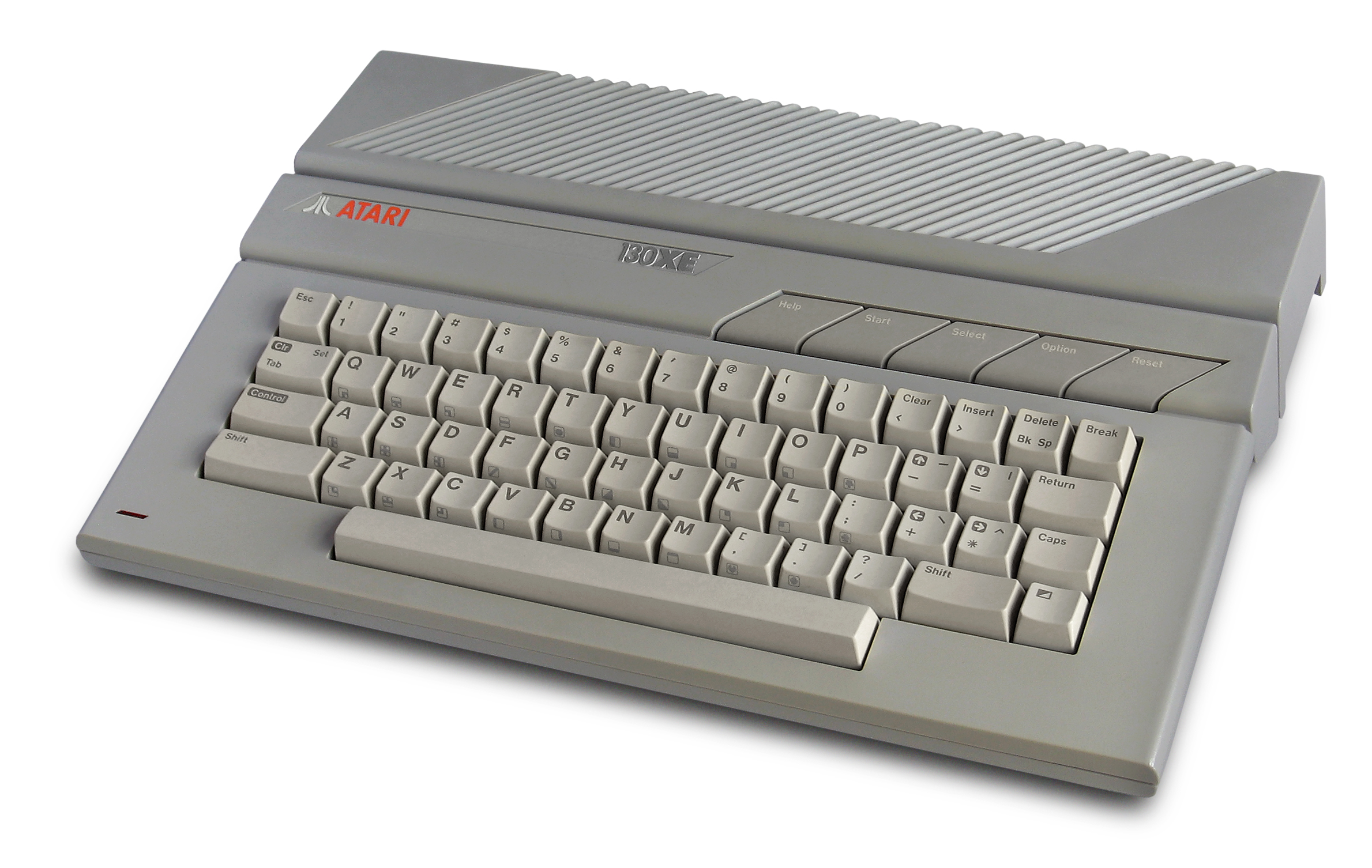 A gray Atari 130XE computer with integrated keyboard and five function keys.