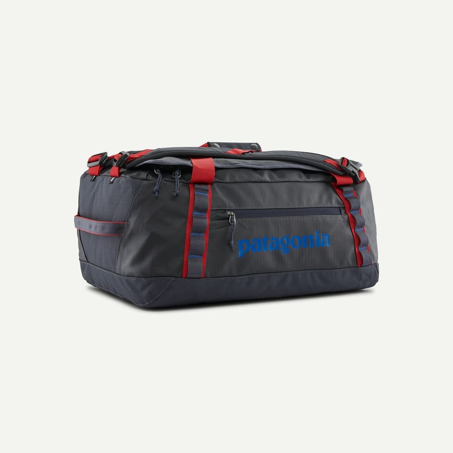 Dark gray Patagonia Black Hole Duffel 40L with red handles and a blue Patagonia logo