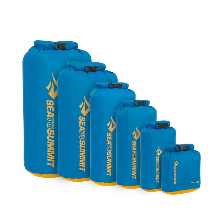 A row of blue Sea to Summit Evac roll-top dry bags in six sizes