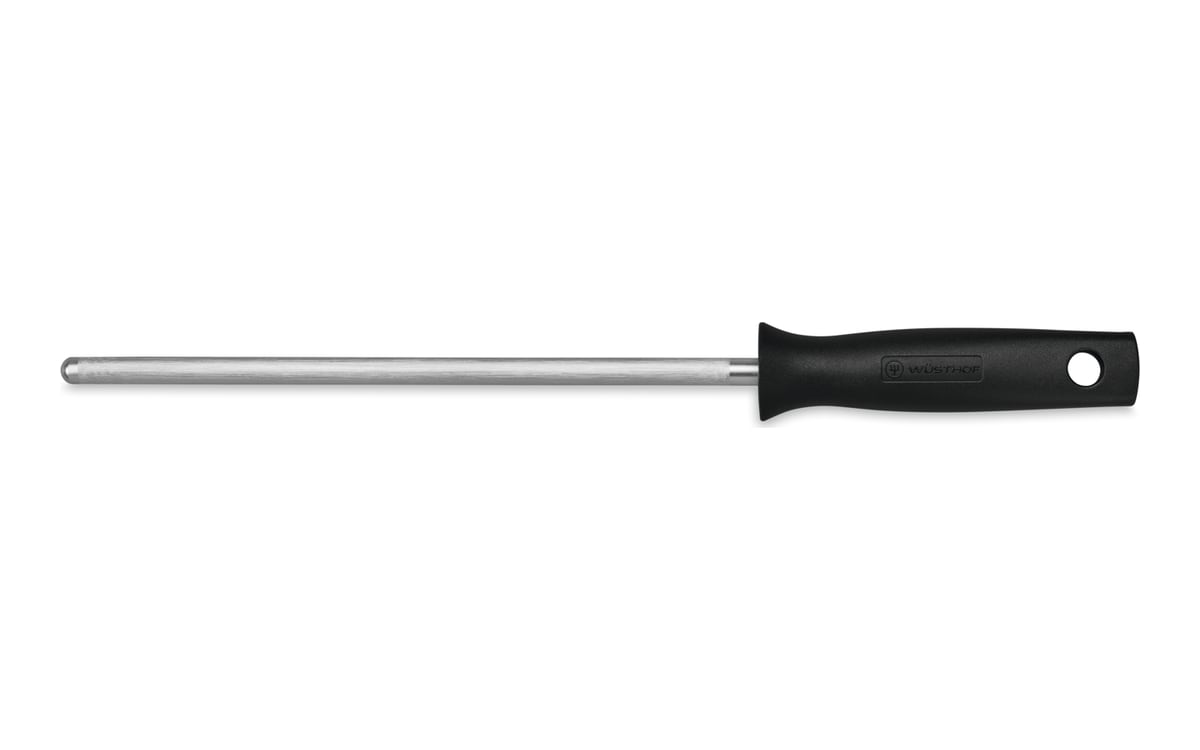 Wüsthof honing steel on white: a long thin steel rod with a black plastic handle on the right