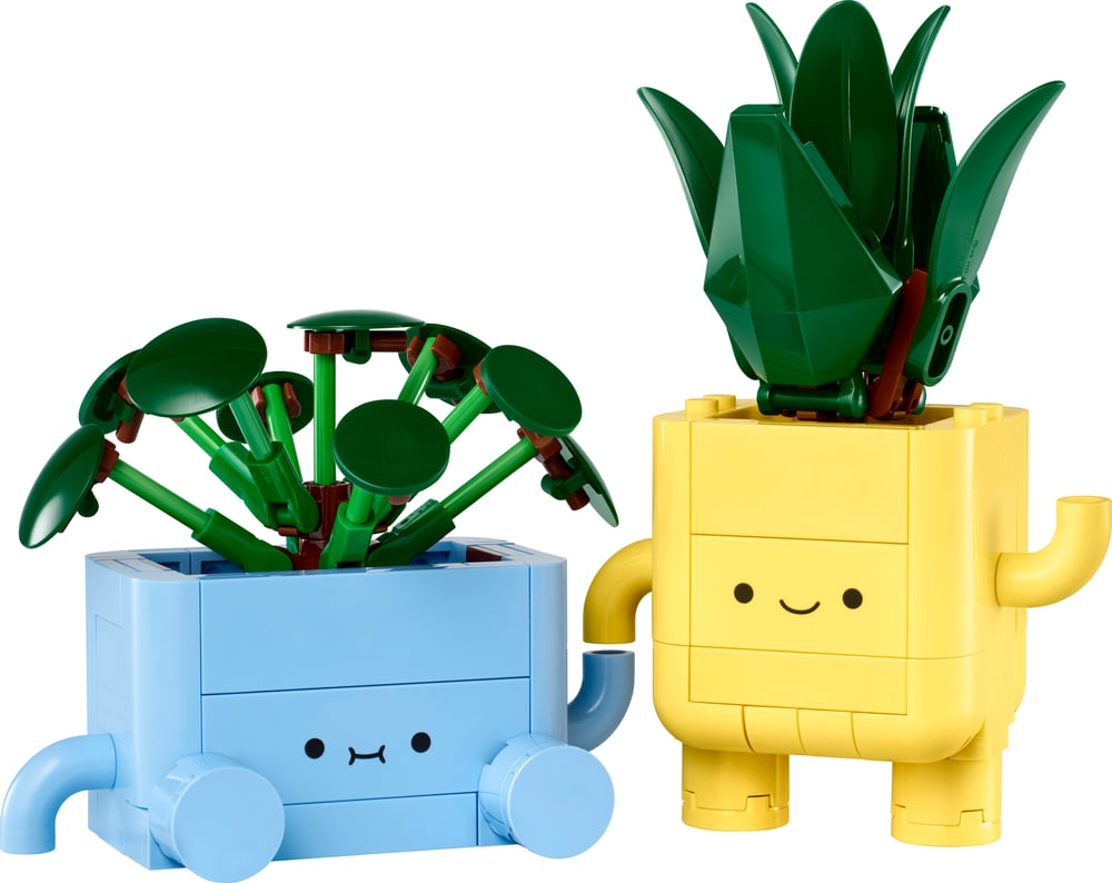 Two smiling LEGO plants in interchangeable yellow and blue pots