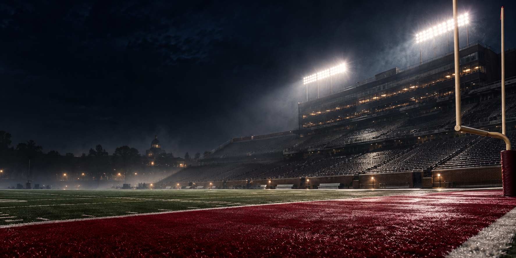 Illustrated empty football stadium beneath night lights