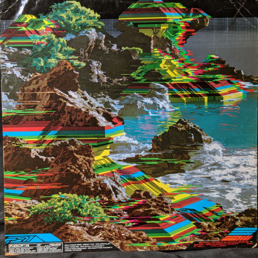 Rainbow glitch pouring over tide rocks